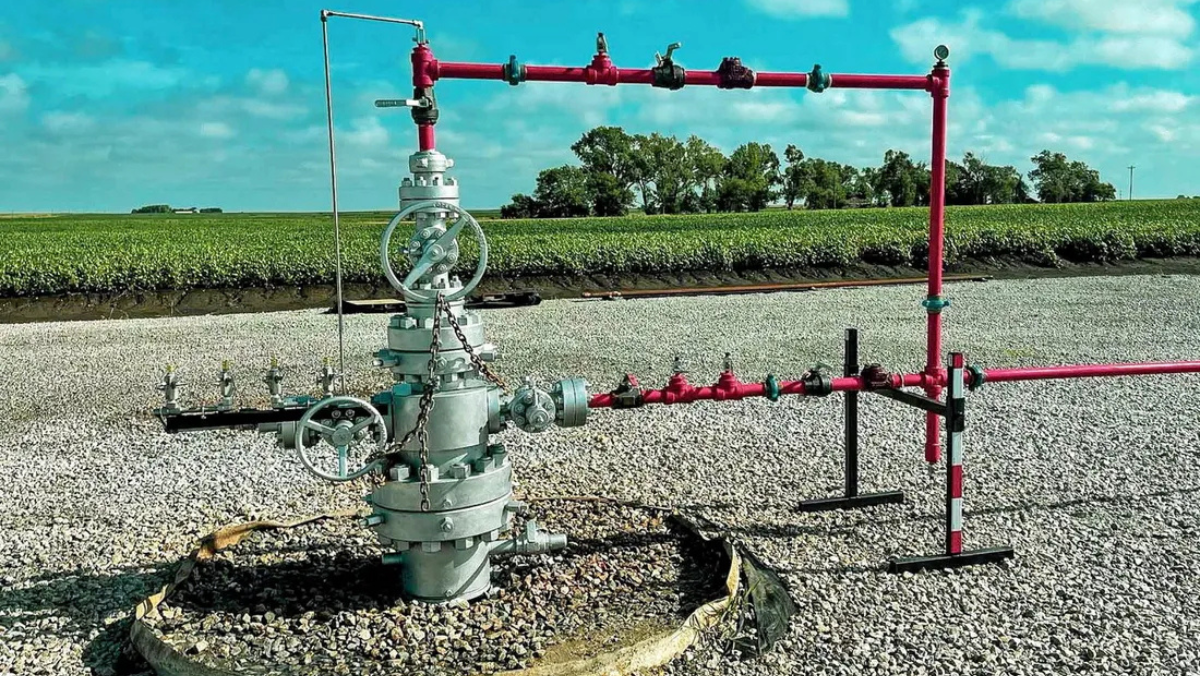 Hydrogen exploration wellhead with valves and piping installed on a gravel pad