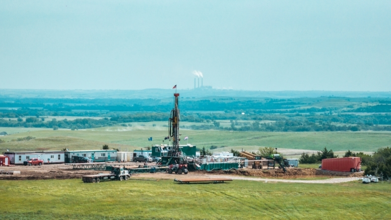 Exploration drilling rig and equipment in open terrain